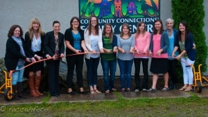 Members of the family services team cut the ribbon at Revelstoke's new family centre. (From left) Andree Rioux, Kelly Silzer, Gorette Imm, Erin MacLachlan, Sheena Bell, Lindsay Legebokoff, Kaitlin Larson, Christina Chamberlain, Amanda MacIntosh, Stacy Sanchez and Karley Trauzzi. Photo: Community Connections.