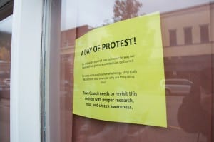 A day of protest: These protest signs were posted on the papered over businesses in downtown Revelstoke. Photo: Revelstoke Mountaineer