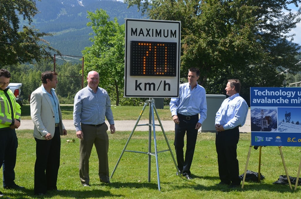 A new variable speed limit sign is unveiled in Revelstoke on June 15. From left: Golden mayor Ron Oszust, B.C. Minister of Transportation and Infrastructure Todd Stone, Revelstoke mayor Mark McKee, Shuswap MLA Greg Kyllo, and a highway enforcement officer. Photo: Aaron Orlando/Revelstoke Mountaineer