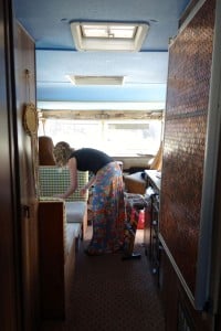 Plenty of space in this old girl. The penny covered fridge, right, is one of the many creative features in Dean's RV sanctuary. Photo: Emily Kemp/Revelstoke Mountaineer.