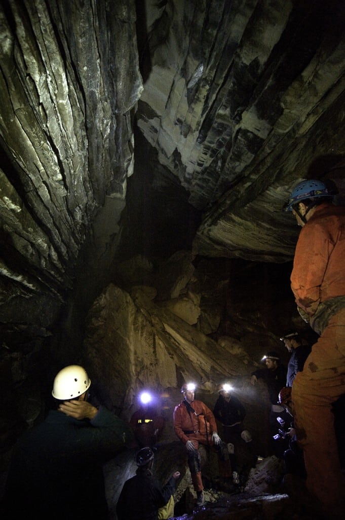A group rests while exploring the Nakimu Caves located near Rogers Pass. Photo: Rob Buchanan/Parks Canada