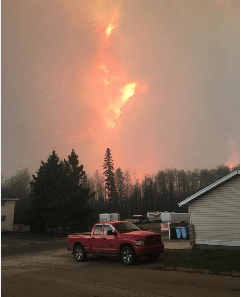 Janelle Jesson posted this image to Instagram and described the scene. "A picture I took outside of my uncles home in abasand before I ran to safety with gabe in his stroller to meet up with my nan and pop at father turc school downtown where my cousins got moved to from father beau, if I didn't leave when I did me and gabe would have been worse off seeing how close it was." Photo: janellejesson