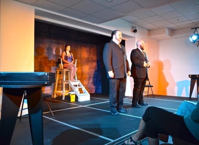 Frank (Ray Cooper) and Bill (Darren McKay) face off in the abstract theatre piece Never Swim Alone, with Lisa (Danielle Foisy) refereeing. Photo: Emily Kemp/Revelstoke Mountaineer