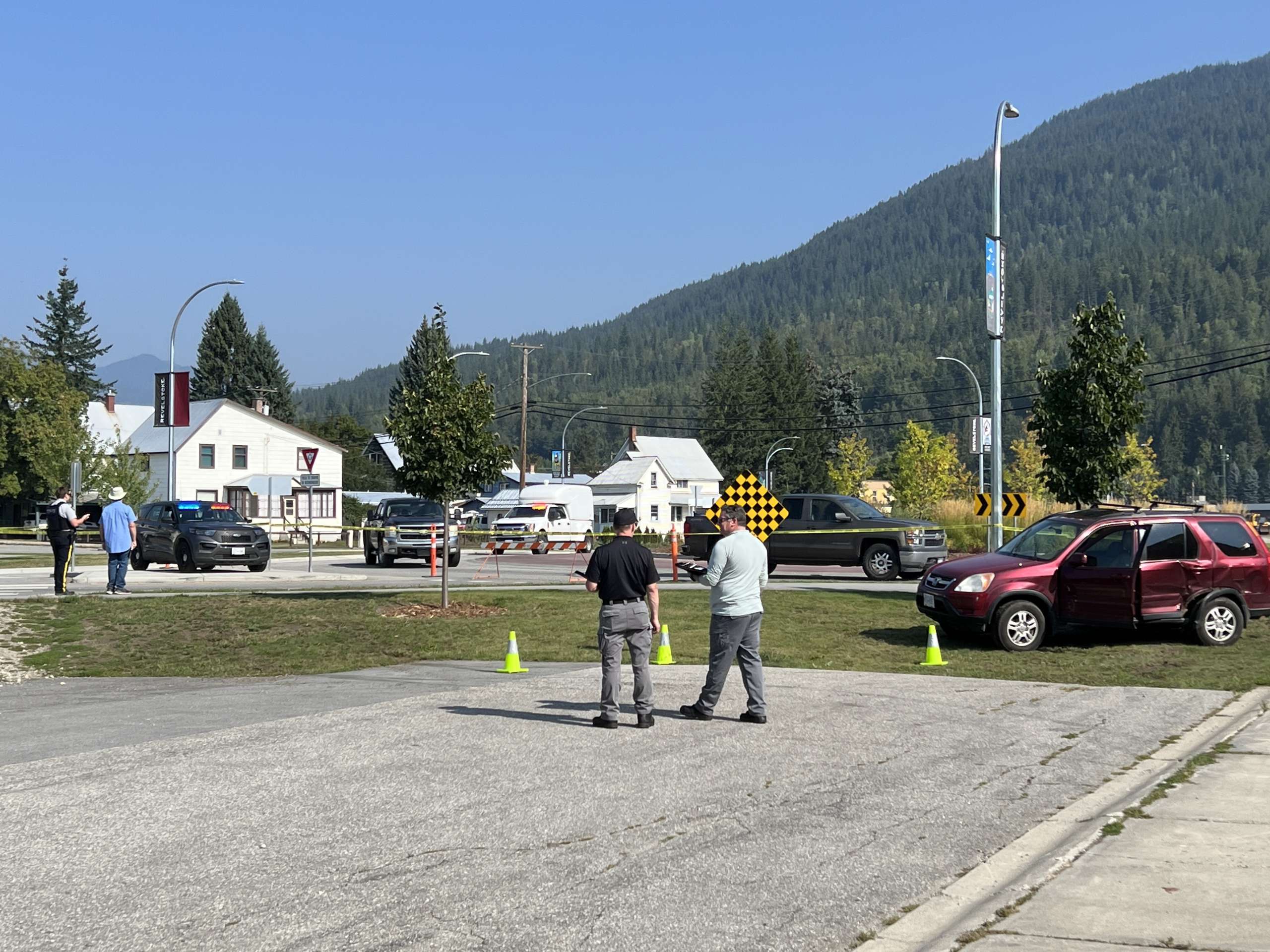 Investigators and RCMP observe the scene of a vehicle altercation and shooting in Revelstoke.