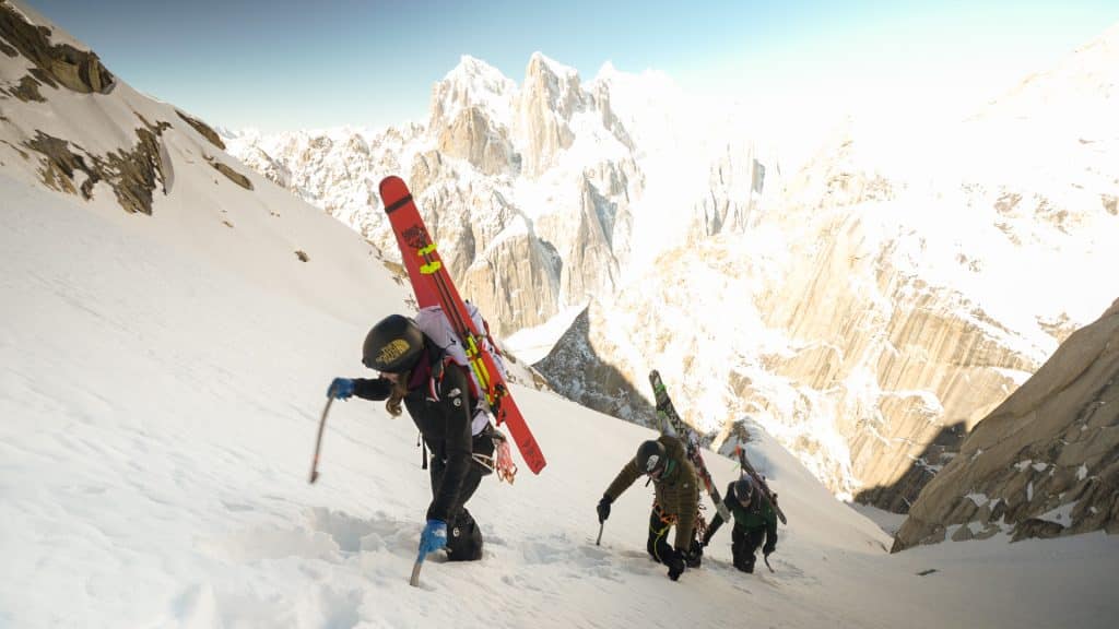 Three skiiers climb the Karakoram Mountain Range in a new film. Mountains are in the background. 