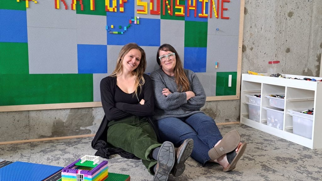 Ray of Sunshine team Sawyer Ellingboe and Jo Gawler at the LEGO play space.