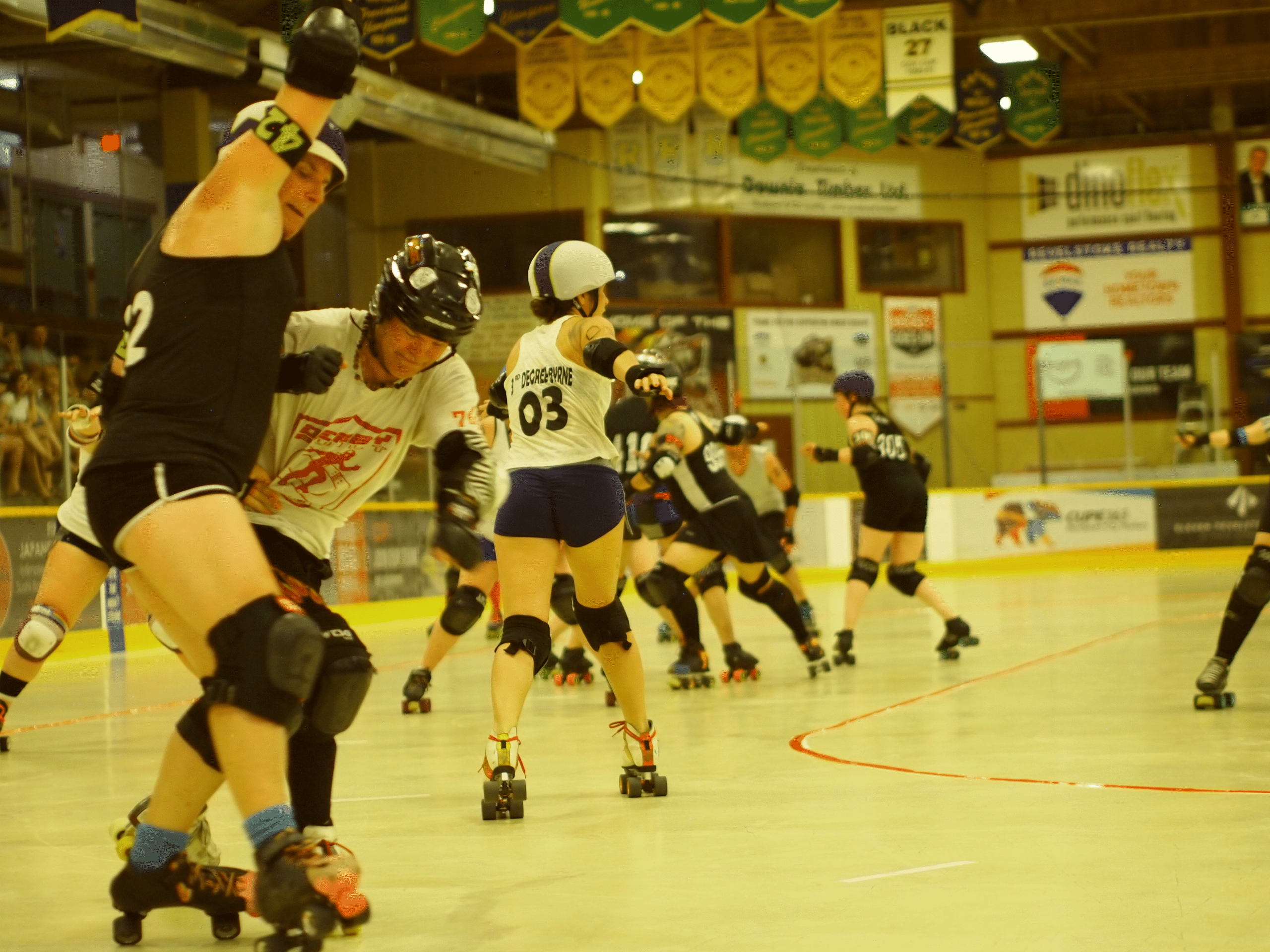 Revelstoke Derailer teammates push through a rival crowd of skaters for the point.