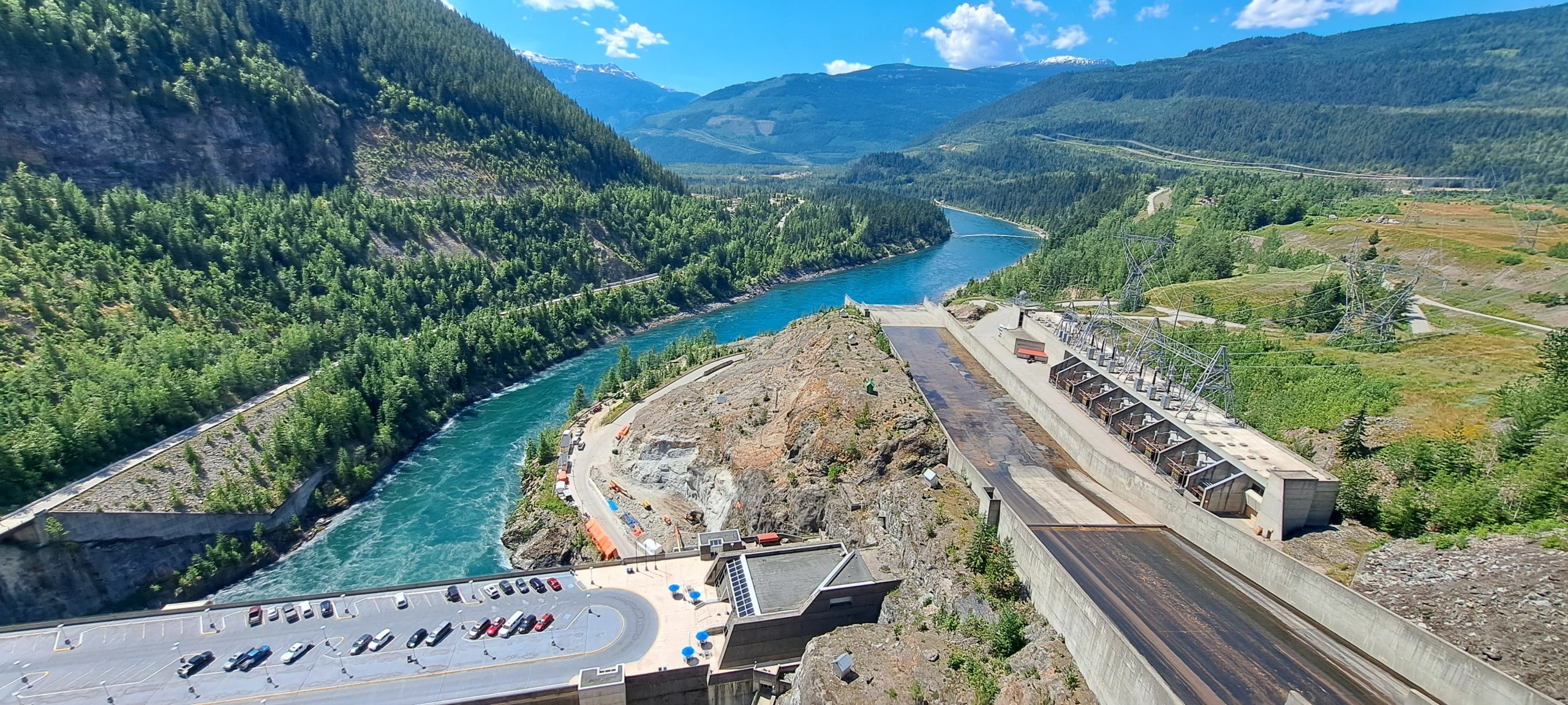 Wide angle shot overlooking the Revelstoke dam and the Columbia river winding into the valley north of Revelstoke
